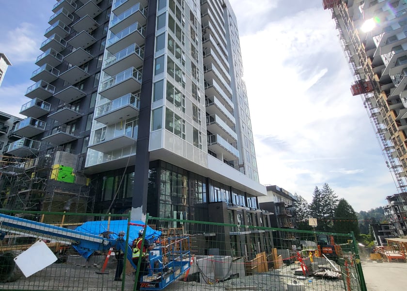 High-rise construction site exterior with safety barriers